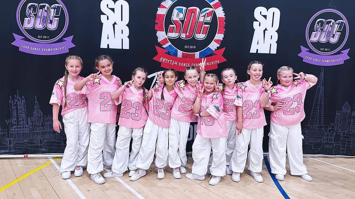 Dionne Dalton greeting young children at the door of HK Dance Studios Billericay, children in leggings and t-shirts ready for their first dance class