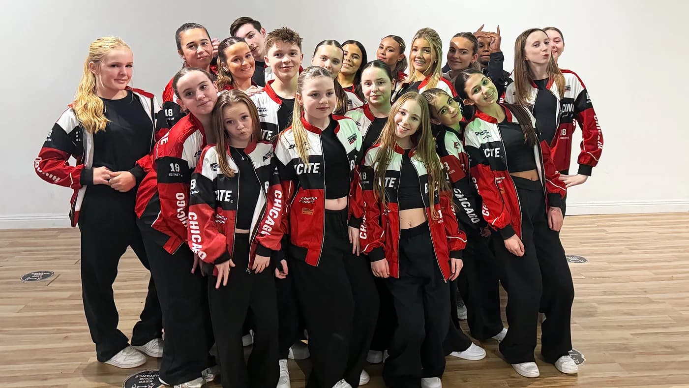The HK Elite team in matching tracksuits at the studio